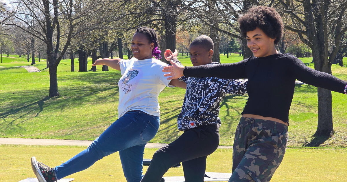 students balancing on one foot